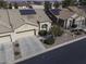 Aerial view of a house with solar panels, double garage, and desert landscaping at 1548 E Melrose Dr, Casa Grande, AZ 85122