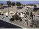 Aerial view of a house with solar panels and a two-car garage at 1548 E Melrose Dr, Casa Grande, AZ 85122