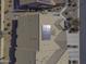 Aerial view of a house with solar panels and tile roof at 1548 E Melrose Dr, Casa Grande, AZ 85122