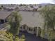 Aerial view of the back of a house with tile roof and desert landscaping at 1548 E Melrose Dr, Casa Grande, AZ 85122