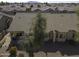 Aerial view of the back of house with tile roof and desert landscaping at 1548 E Melrose Dr, Casa Grande, AZ 85122