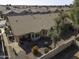 Aerial view of a house with solar panels and a desert landscape at 1548 E Melrose Dr, Casa Grande, AZ 85122