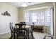 Bright dining area with bay window and seating for four at 1548 E Melrose Dr, Casa Grande, AZ 85122