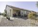 Rear exterior view showing patio and landscaping at 1548 E Melrose Dr, Casa Grande, AZ 85122