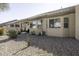 Rear exterior with covered patio and desert landscaping at 1548 E Melrose Dr, Casa Grande, AZ 85122