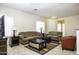 Living room with a sofa, loveseat, coffee table, and end tables at 1548 E Melrose Dr, Casa Grande, AZ 85122