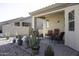 Covered patio with seating area and desert landscaping at 1548 E Melrose Dr, Casa Grande, AZ 85122