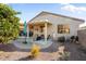 Spacious backyard with covered patio and desert landscaping at 16148 W Starlight Dr, Surprise, AZ 85374