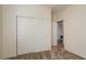 Spacious bedroom with mirrored closet doors and neutral carpeting at 16148 W Starlight Dr, Surprise, AZ 85374