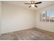 Bright and airy bedroom with neutral carpeting and plantation shutters at 16148 W Starlight Dr, Surprise, AZ 85374