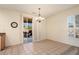 Bright dining area with tile floors and access to patio at 16148 W Starlight Dr, Surprise, AZ 85374