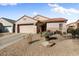 Single story home with two car garage and desert landscaping at 16148 W Starlight Dr, Surprise, AZ 85374