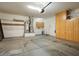 Garage with utility sink, extra storage, and shelving at 16148 W Starlight Dr, Surprise, AZ 85374