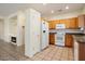 Kitchen features wood cabinets, granite counters and white appliances at 16148 W Starlight Dr, Surprise, AZ 85374