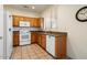 Well-equipped kitchen featuring wood cabinets, granite countertops, and modern appliances at 16148 W Starlight Dr, Surprise, AZ 85374