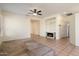 Living room with fireplace, tile floors, and neutral decor at 16148 W Starlight Dr, Surprise, AZ 85374