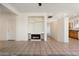 Living area featuring a fireplace and built-in shelving at 16148 W Starlight Dr, Surprise, AZ 85374