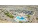 Aerial view of community pool, clubhouse, and parking at 18961 N 264Th Ave, Buckeye, AZ 85396