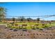 Community lawn with cornhole and seating, perfect for entertainment at 18961 N 264Th Ave, Buckeye, AZ 85396