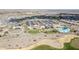 Aerial view of community, highlighting clubhouse, pool, and homes at 18961 N 264Th Ave, Buckeye, AZ 85396