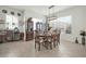 Formal dining room with a round table and wood chairs at 18961 N 264Th Ave, Buckeye, AZ 85396