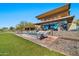 Outdoor firepit with seating near clubhouse at 18961 N 264Th Ave, Buckeye, AZ 85396