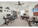 Home office with built-in shelving and window light at 18961 N 264Th Ave, Buckeye, AZ 85396