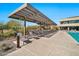 Pool deck with lounge chairs and shade structures at 18961 N 264Th Ave, Buckeye, AZ 85396