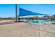 Stunning pool area with blue shade sail at 18961 N 264Th Ave, Buckeye, AZ 85396