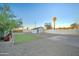 Spacious backyard featuring a mix of gravel, grass, and landscaping for a serene outdoor experience at 1934 E Brill St, Phoenix, AZ 85006