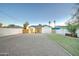 Gravel backyard with block fence, small patch of green grass, and an exterior door at 1934 E Brill St, Phoenix, AZ 85006