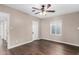 Bright bedroom featuring a ceiling fan, hardwood floors, and natural light from the window at 1934 E Brill St, Phoenix, AZ 85006