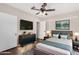 Cozy bedroom featuring modern furniture, hardwood floors, a ceiling fan and natural light at 1934 E Brill St, Phoenix, AZ 85006