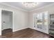 Dining area showcasing wood floors, modern lighting fixture, and doorway at 1934 E Brill St, Phoenix, AZ 85006