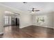 Spacious living room featuring beautiful wood floors, natural light, and archway to kitchen at 1934 E Brill St, Phoenix, AZ 85006