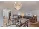 Open dining area with a view into the living room and kitchen at 19611 N Stardust Blvd, Sun City West, AZ 85375