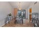 Elegant dining room with a glass table and chandelier at 19611 N Stardust Blvd, Sun City West, AZ 85375