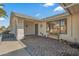 Brick paved entryway with decorative iron door and a welcoming bench at 19611 N Stardust Blvd, Sun City West, AZ 85375