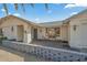 Brick paved entryway with decorative iron door and a welcoming bench at 19611 N Stardust Blvd, Sun City West, AZ 85375