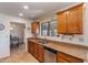 Kitchen with wood cabinets, granite counters and stainless steel appliances at 19611 N Stardust Blvd, Sun City West, AZ 85375