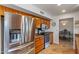 Stainless steel appliances and wood cabinetry highlight this kitchen at 19611 N Stardust Blvd, Sun City West, AZ 85375