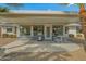 Covered patio with seating area, great for outdoor dining and relaxation at 19611 N Stardust Blvd, Sun City West, AZ 85375