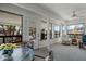 Sunroom with ample natural light and comfortable seating at 19611 N Stardust Blvd, Sun City West, AZ 85375