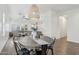 Open floor plan dining room with rustic wood table and stylish modern decor at 20490 N 78Th Way, Scottsdale, AZ 85255