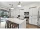 Modern kitchen featuring a center island, stainless steel appliances, white cabinetry, and pendant lighting at 20490 N 78Th Way, Scottsdale, AZ 85255