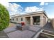 Backyard patio with seating area and water feature at 21004 E Sunset Dr, Queen Creek, AZ 85142