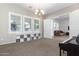 Formal dining room with chandelier, built-in shelving, and large windows at 21004 E Sunset Dr, Queen Creek, AZ 85142