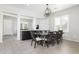 Bright dining room with a large table and chandelier at 21004 E Sunset Dr, Queen Creek, AZ 85142