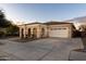 One-story home with a two-car garage and desert landscaping at 21004 E Sunset Dr, Queen Creek, AZ 85142