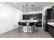 Modern kitchen featuring dark wood cabinets and granite countertops at 21004 E Sunset Dr, Queen Creek, AZ 85142